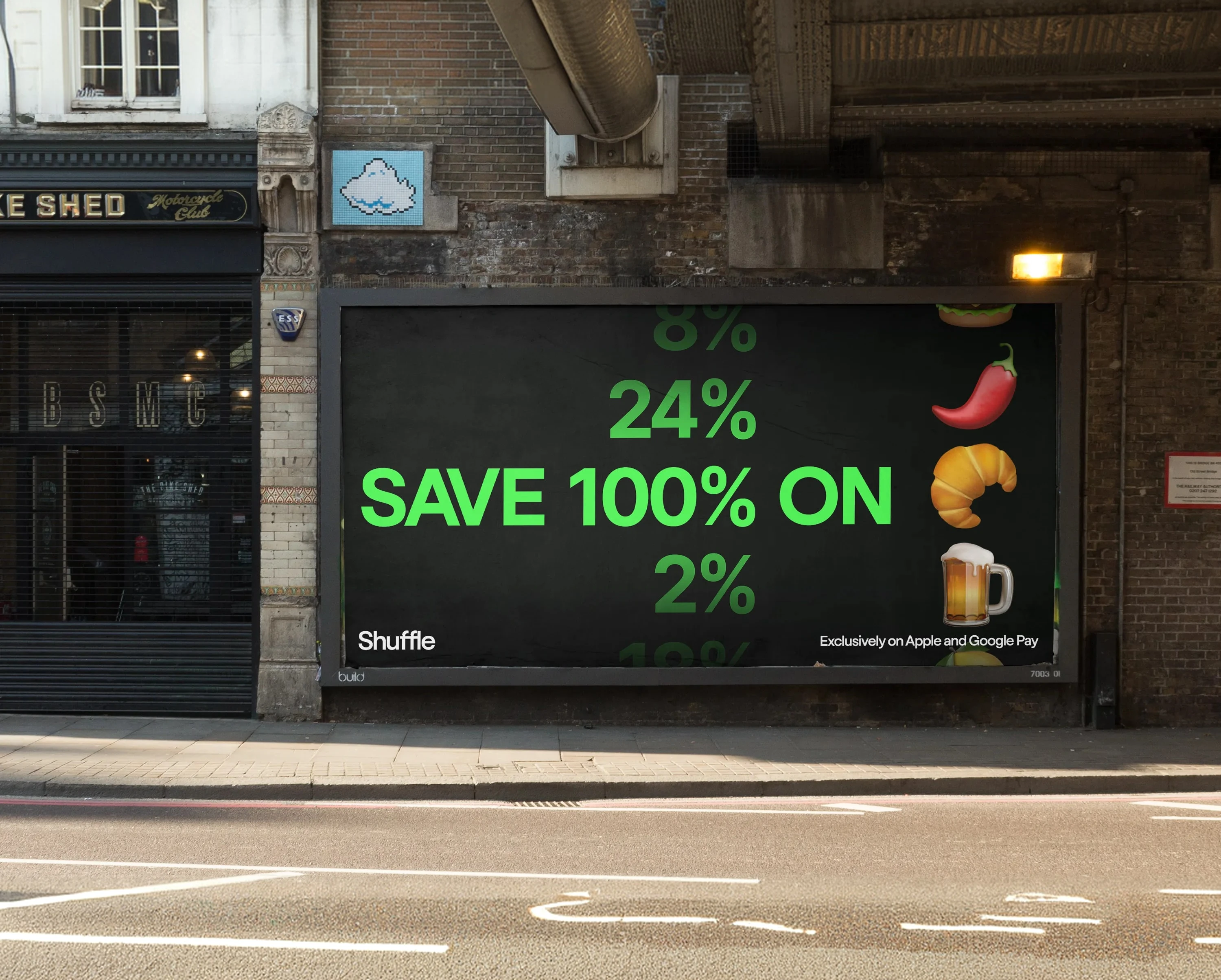 A Shuffle billboard under a railway bridge: “Save 100% on”, with rewards of 2% to 24% ticking past