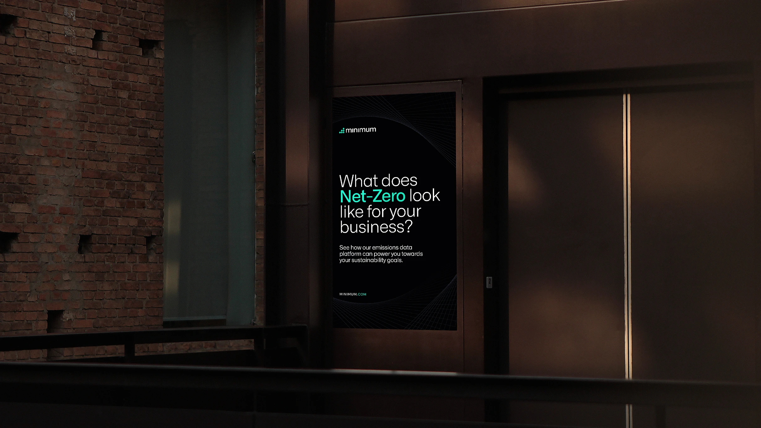 A Minimum poster in a dark corridor: “What does Net-Zero look like for your business?”, with “Net-Zero” in mint