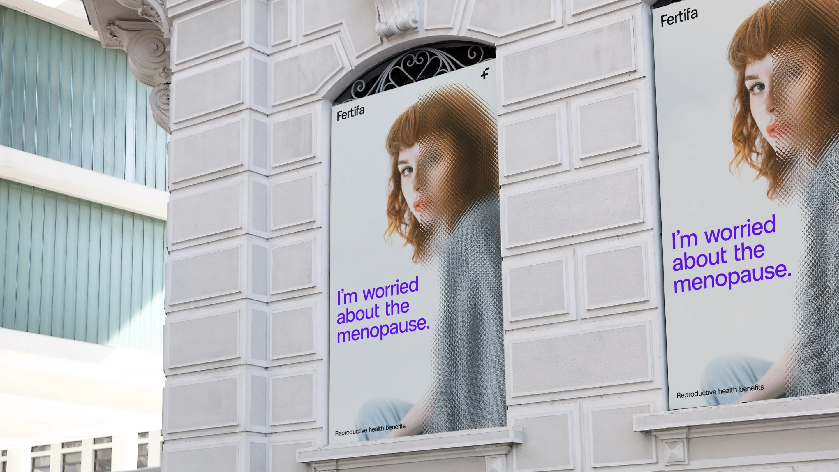 As presented: a poster reading “I’m worried about the menopause.”, the portrait half hidden behind reeded glass