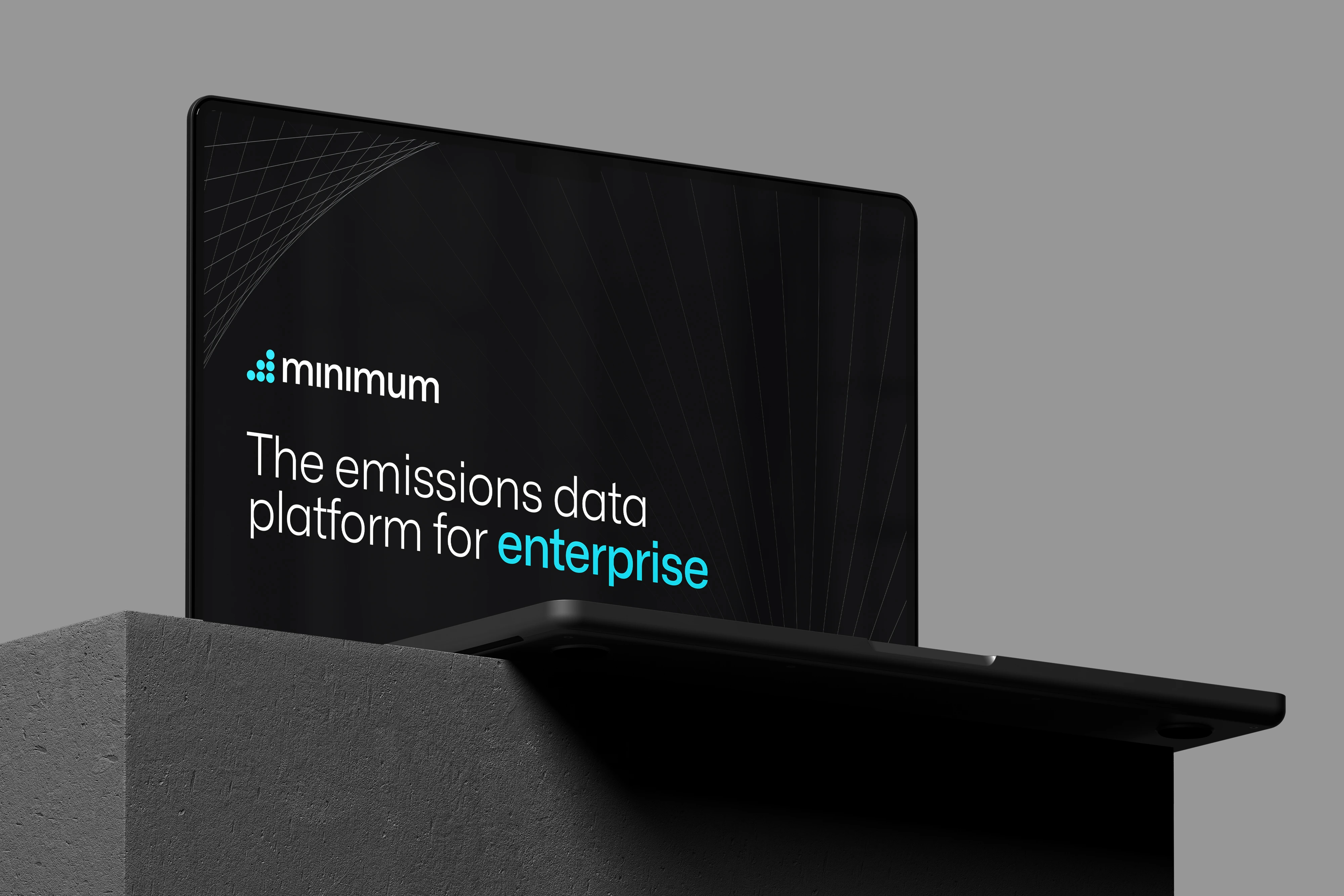 A tablet on a concrete block: “The emissions data platform for enterprise”